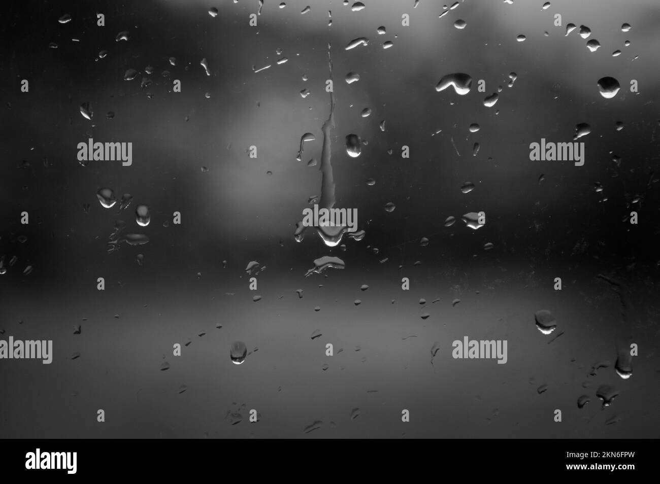 Raindrops on the window. Close-up of raindrops. Stock Photo