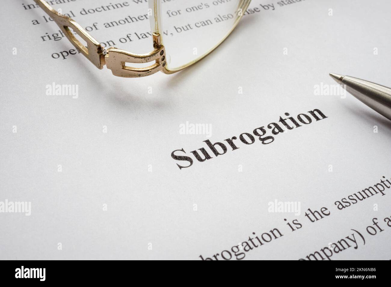Page with info about subrogation and old glasses. Stock Photo