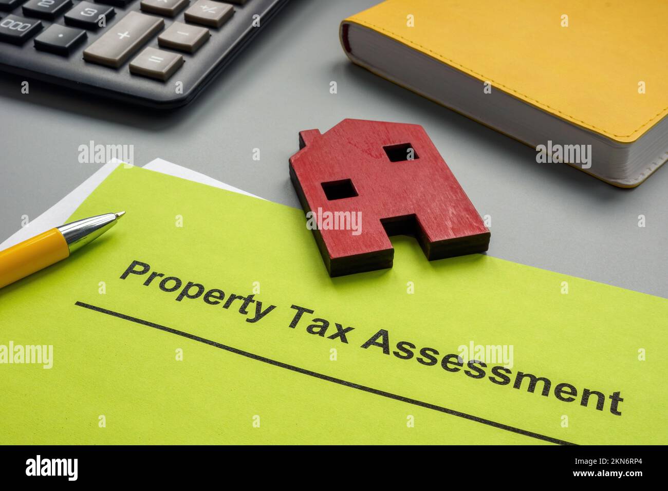 Property tax assessment papers and model of house. Stock Photo