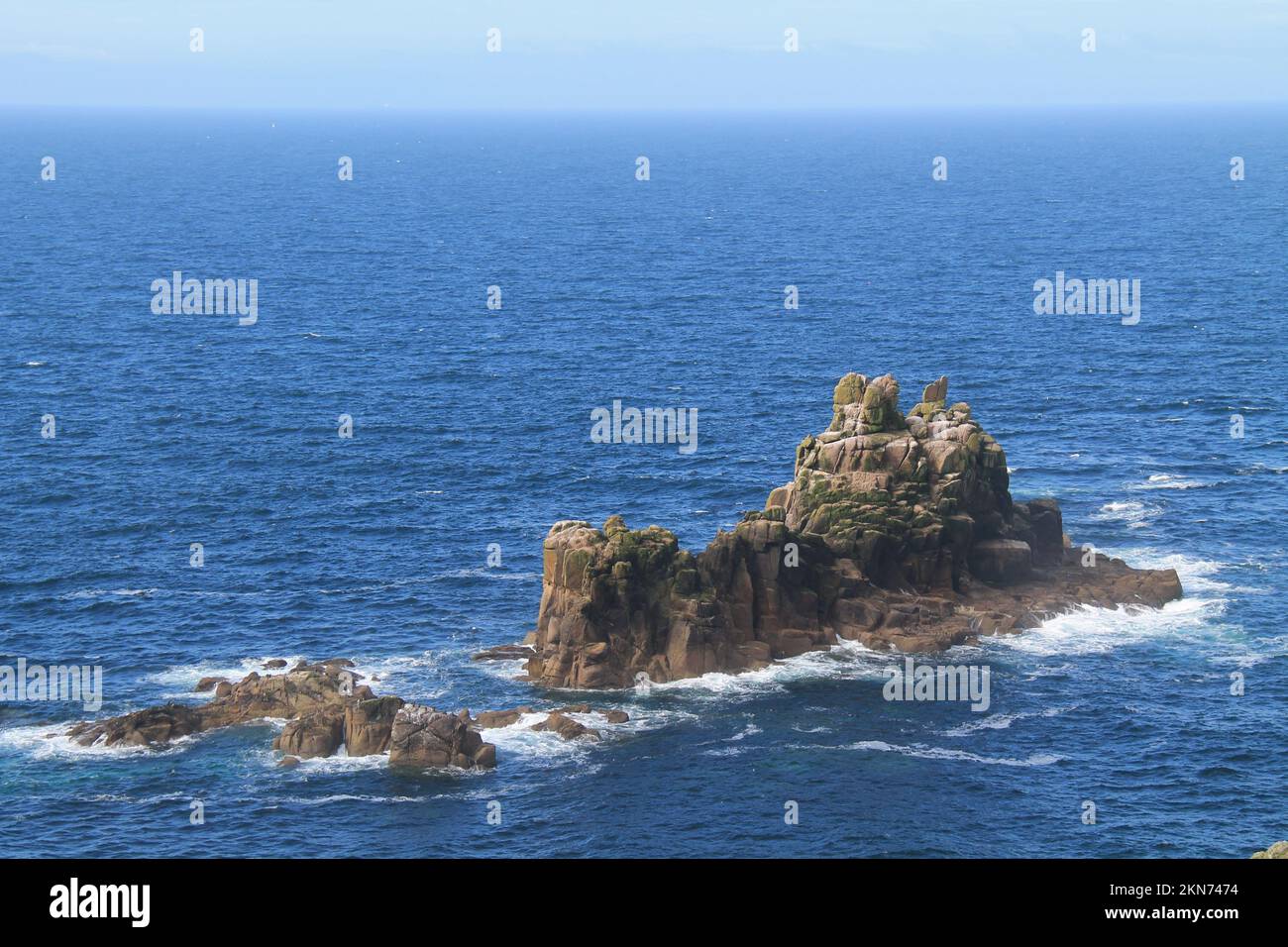 A Rocky Outcrop Island in the Sea. Stock Photo