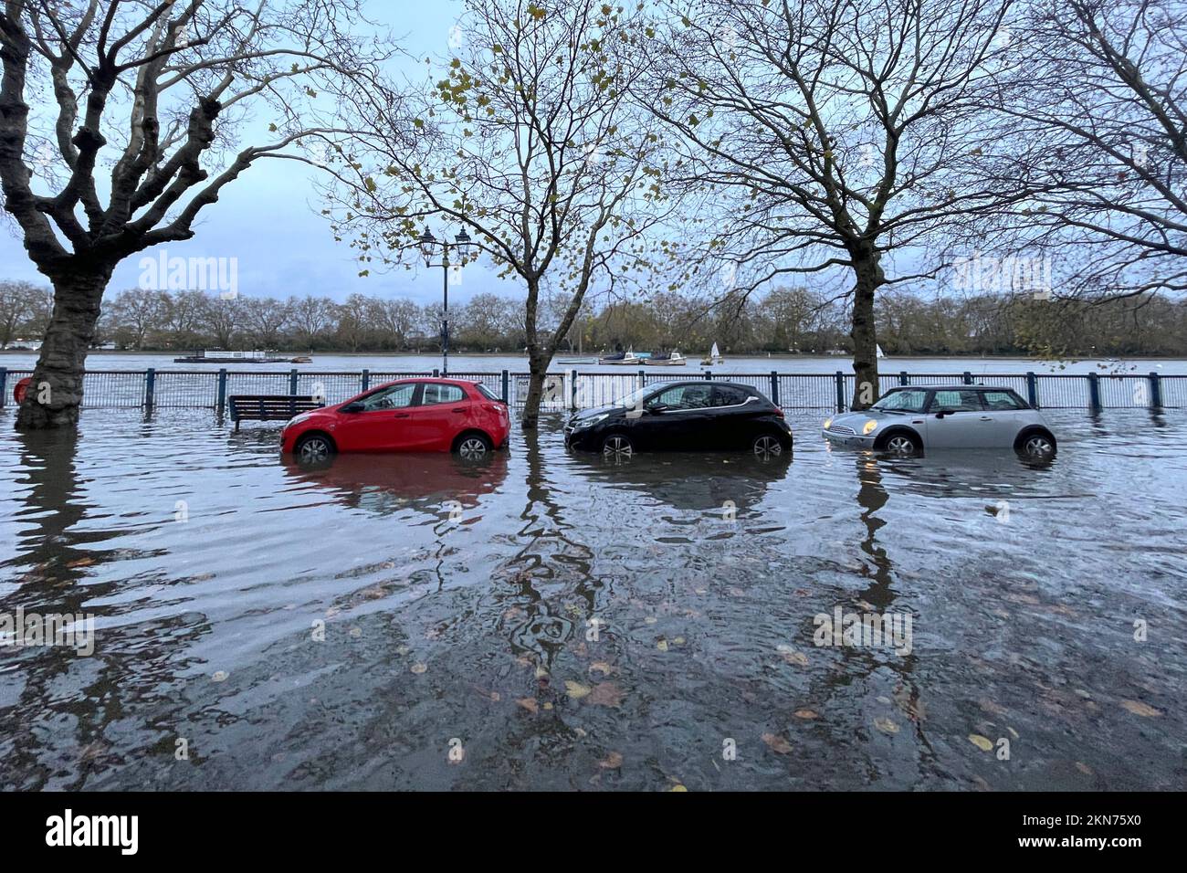 Cars are partially submerged by high tide on River Thames in London, Britain, November 26, 2022. REUTERS/Lucy Nicholson Stock Photo