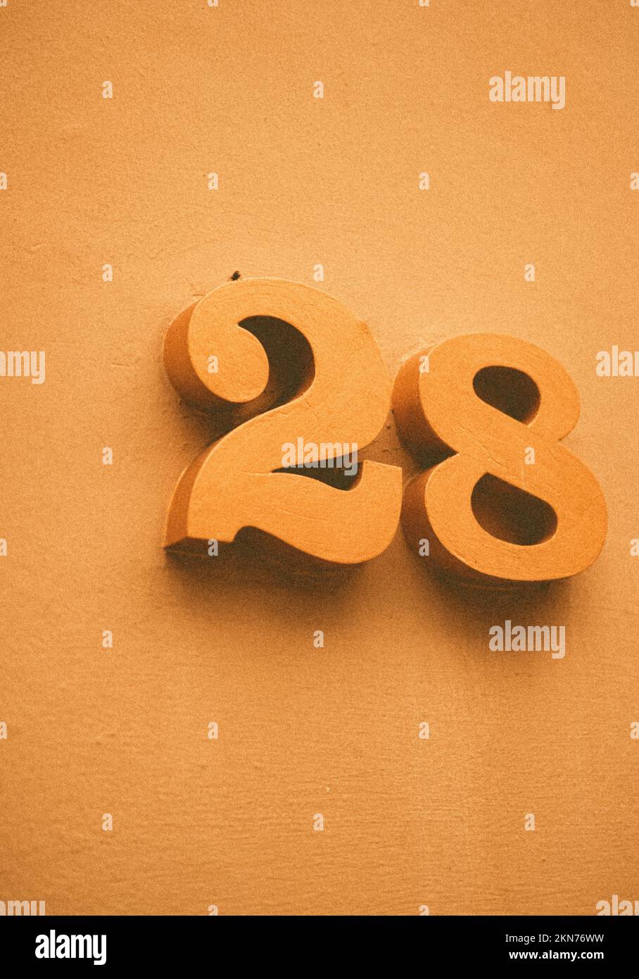 A vertical closeup of plaque plate number address of 