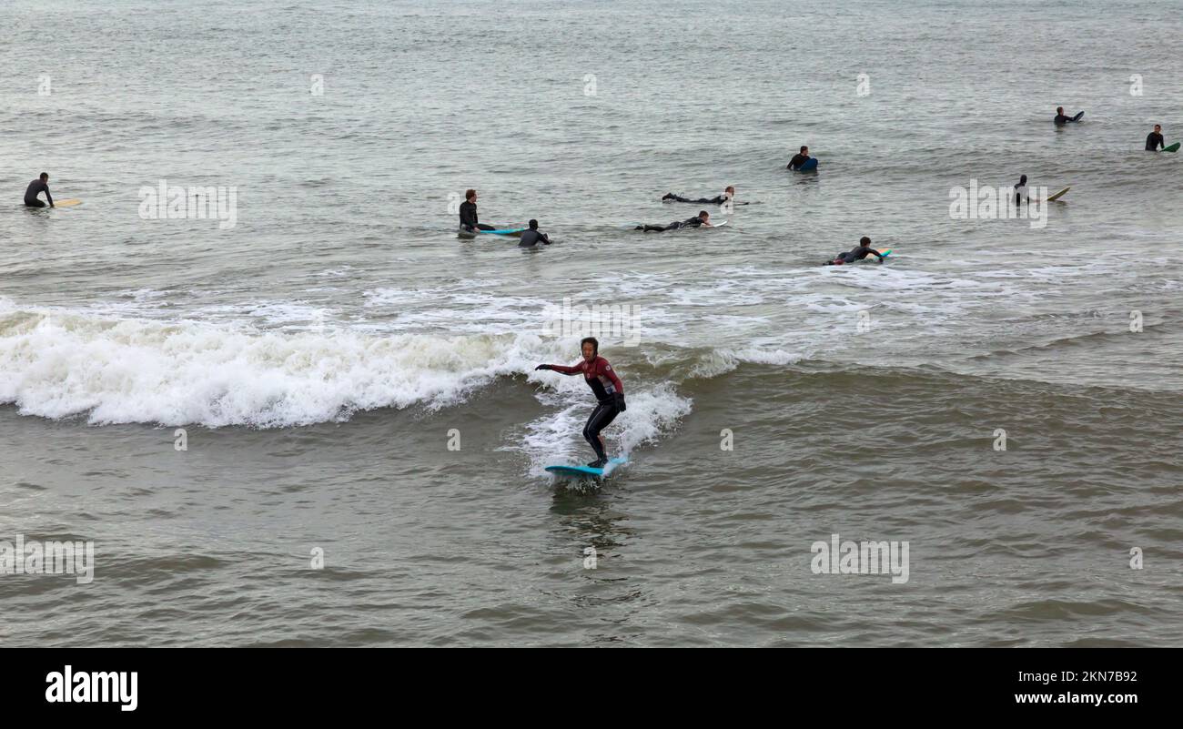 Bournemouth, Dorset UK. 27th November 2022. UK weather: high tides and big waves as surfers head to Bournemouth beach to make the most of the conditions surfing in the sea. Credit: Carolyn Jenkins/Alamy Live News Stock Photo
