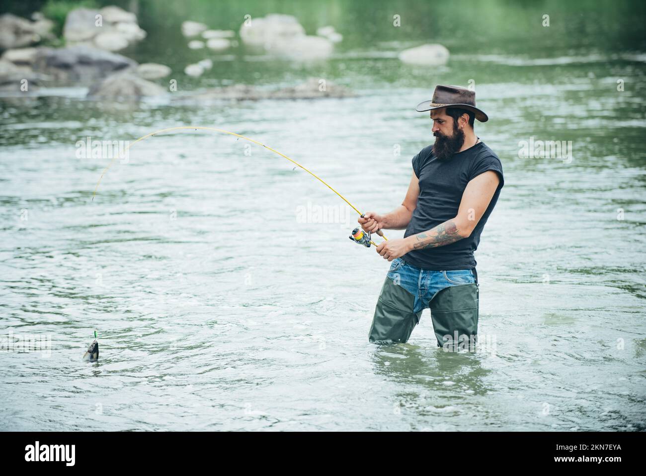 Fishing hobby and summer weekend. Bearded men fisher with fishing rod ...