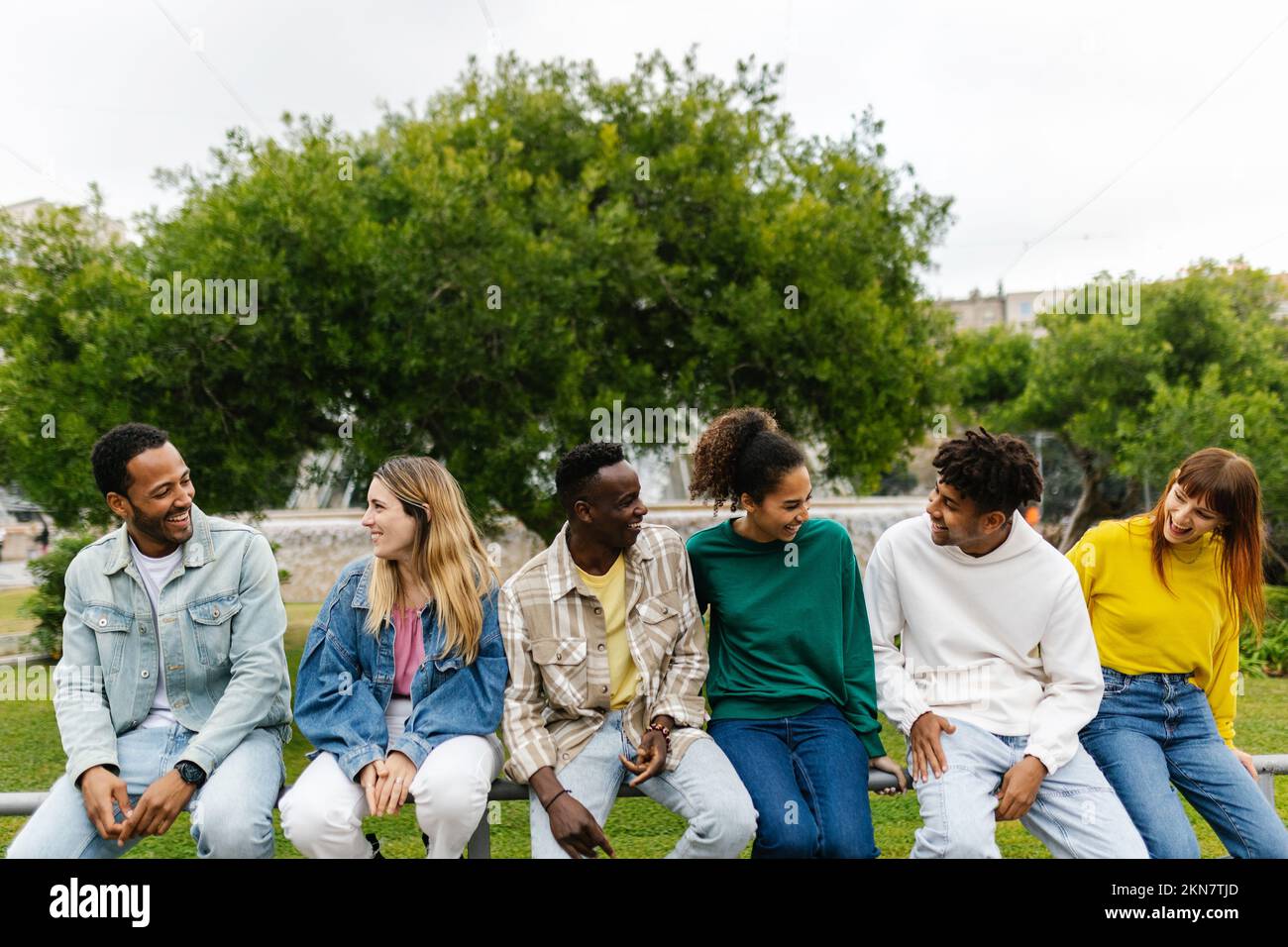 Multi-ethnic group of young friends having fun outdoors Stock Photo