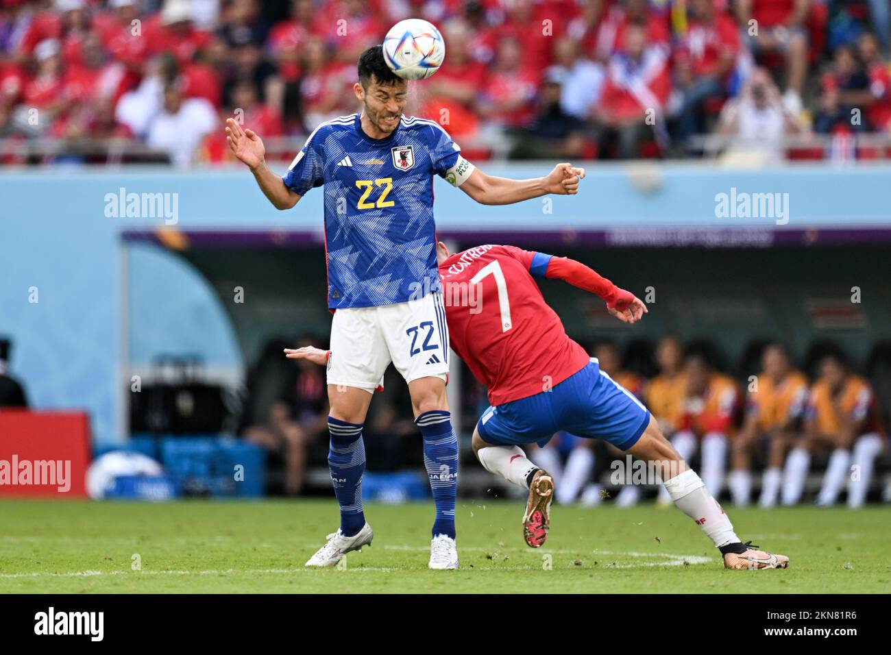 Al Rajjan, Qatar. 27th Nov, 2022. Soccer, Qatar 2022 World Cup, Japan - Costa Rica, Preliminary round, Group E, Matchday 2, Ahmad bin Ali Stadium, Japan's Maya Yoshida (M) heads the ball past Costa Rica's Anthony Contreras. Credit: Federico Gambarini/dpa/Alamy Live News Stock Photo