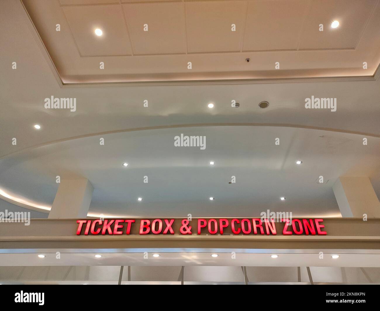 Ticket and popcorn store in a movie theater lobby area Stock Photo