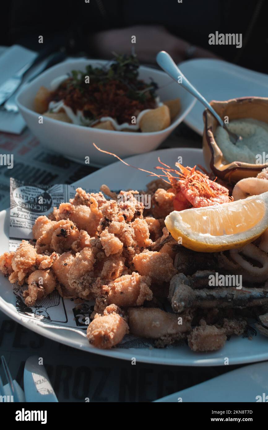A vertical shot of fried baby squid in a tapas bar in Barcelona, Spain
