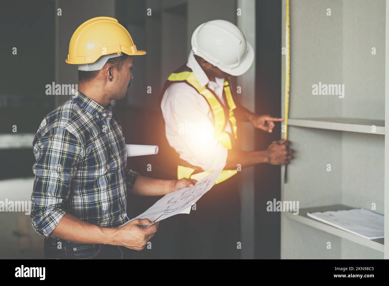 Professional architect designer structural engineer team colleagues discussing building plan design project Stock Photo