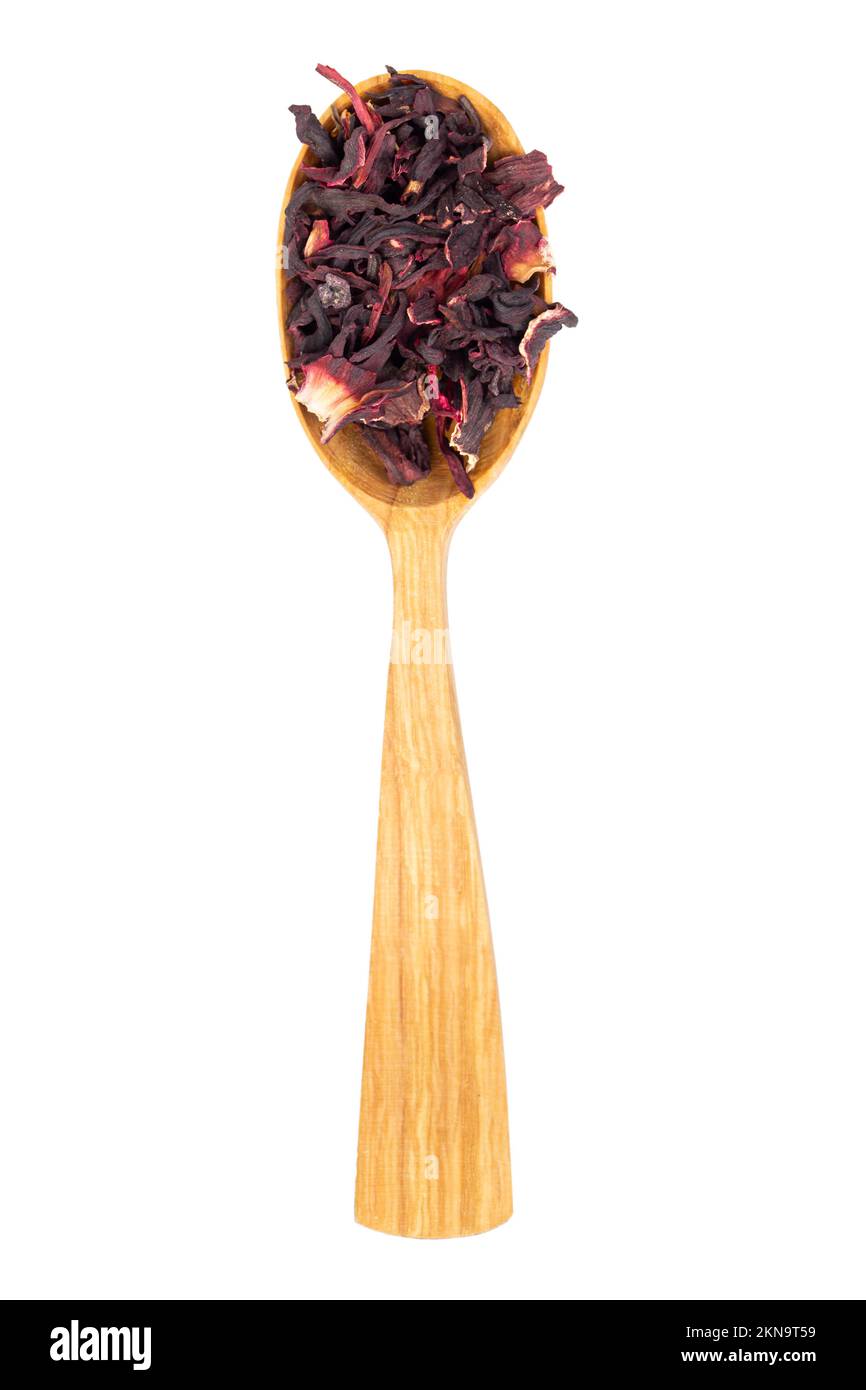 Karkade tea. Hibiscus tea leaves in wooden spoon isolated on white background. File contains clipping path. Top view. Stock Photo