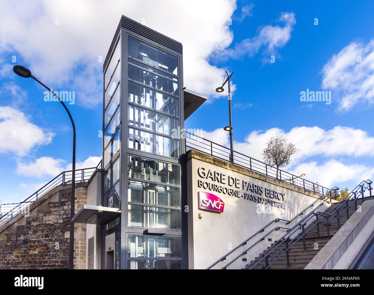 Disability lift and public stairs entrance to SNCF Gare de Paris Bercy (constructed 1977), Paris, France. Stock Photo