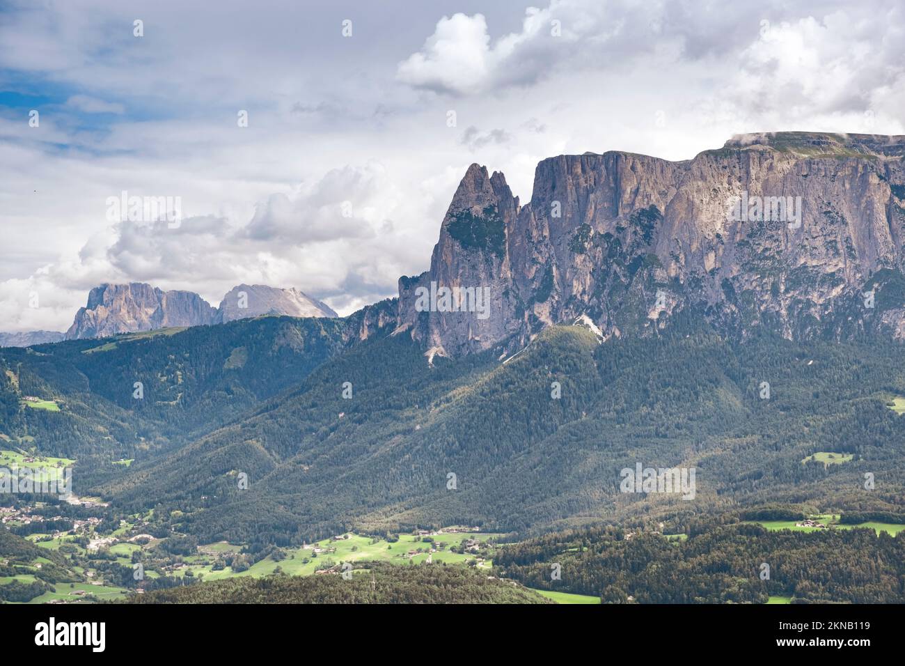 Low Angle View Of Mountain Against Cloudy Sky. Bozen, Italy Stock Photo