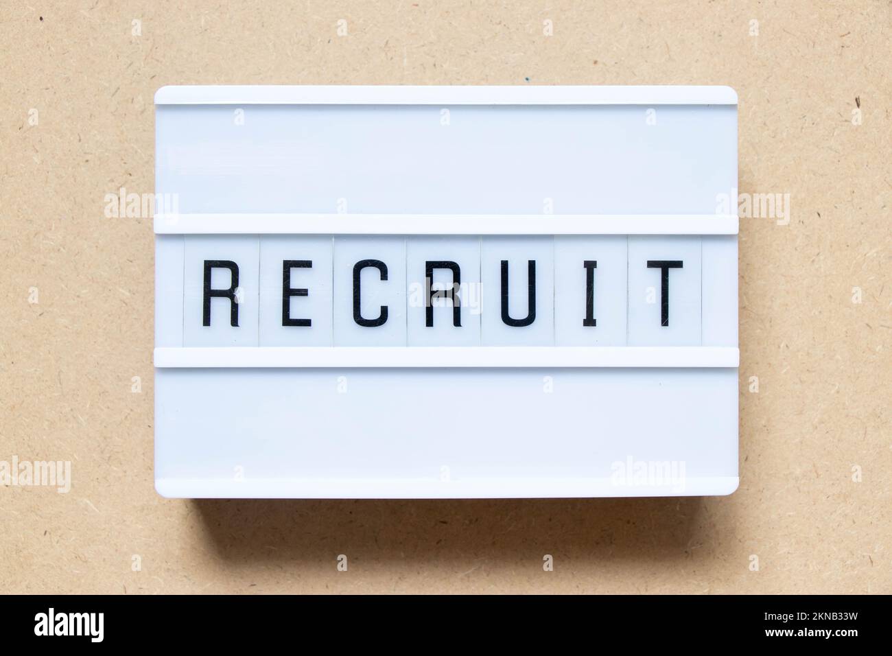Lightbox with word recruit on wood background Stock Photo