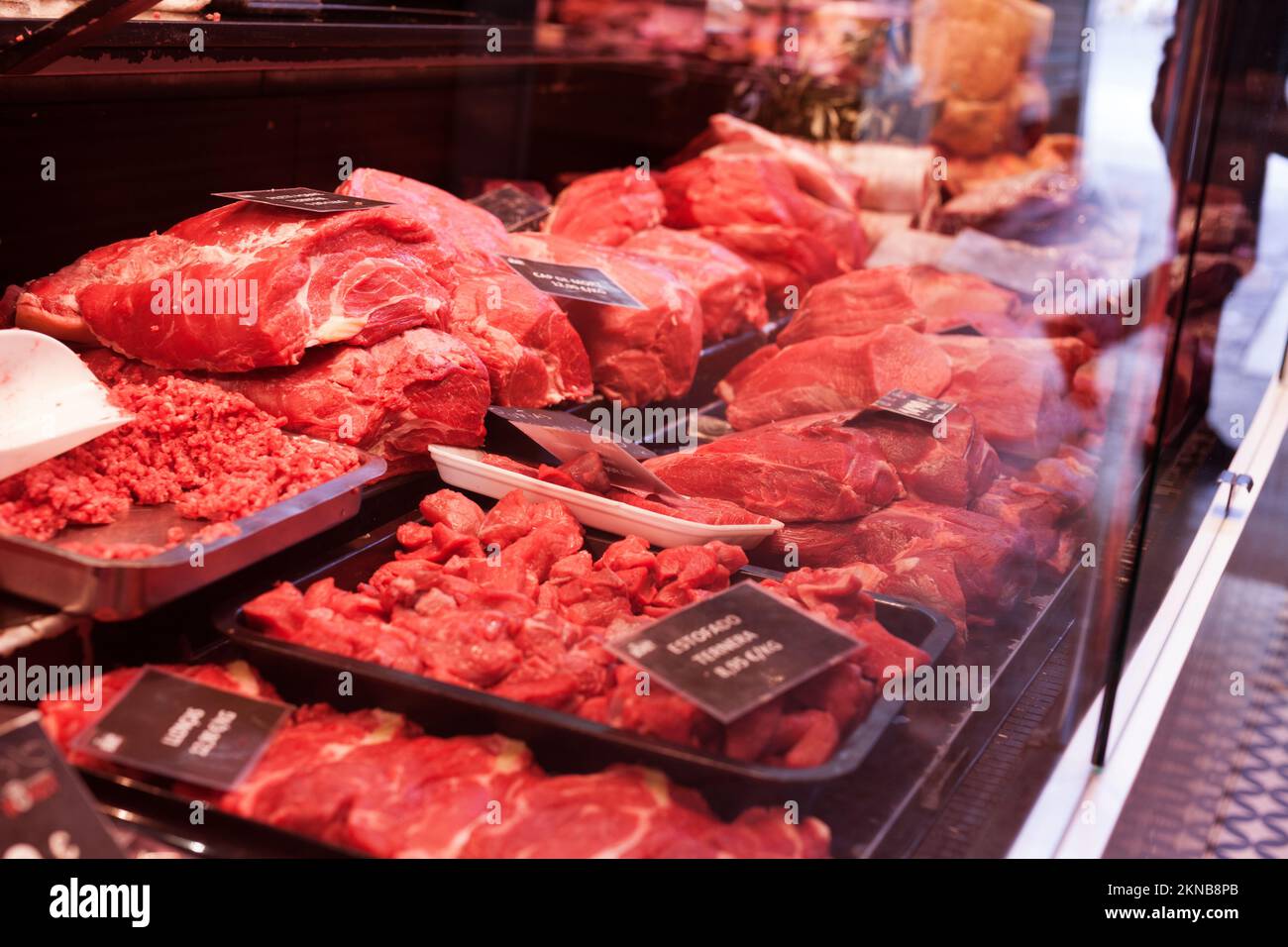 pork, beef, tenderloin, meatballs, entrecote, ham, carbonate in refrigerator on market counter