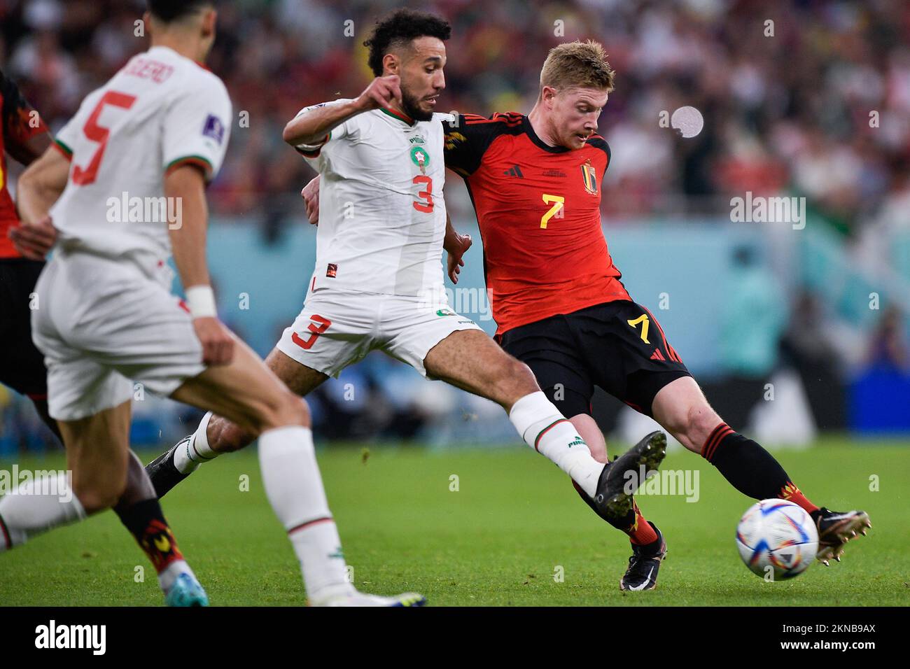 DOHA, QATAR - NOVEMBER 27: Kevin De Bruyne of Belgium battles for the ball with Noussair Mazraoui of Morocco during the Group F - FIFA World Cup Qatar 2022 match between Belgium and Morocco at the Al Thumama Stadium on November 27, 2022 in Doha, Qatar (Photo by Pablo Morano/BSR Agency) Stock Photo