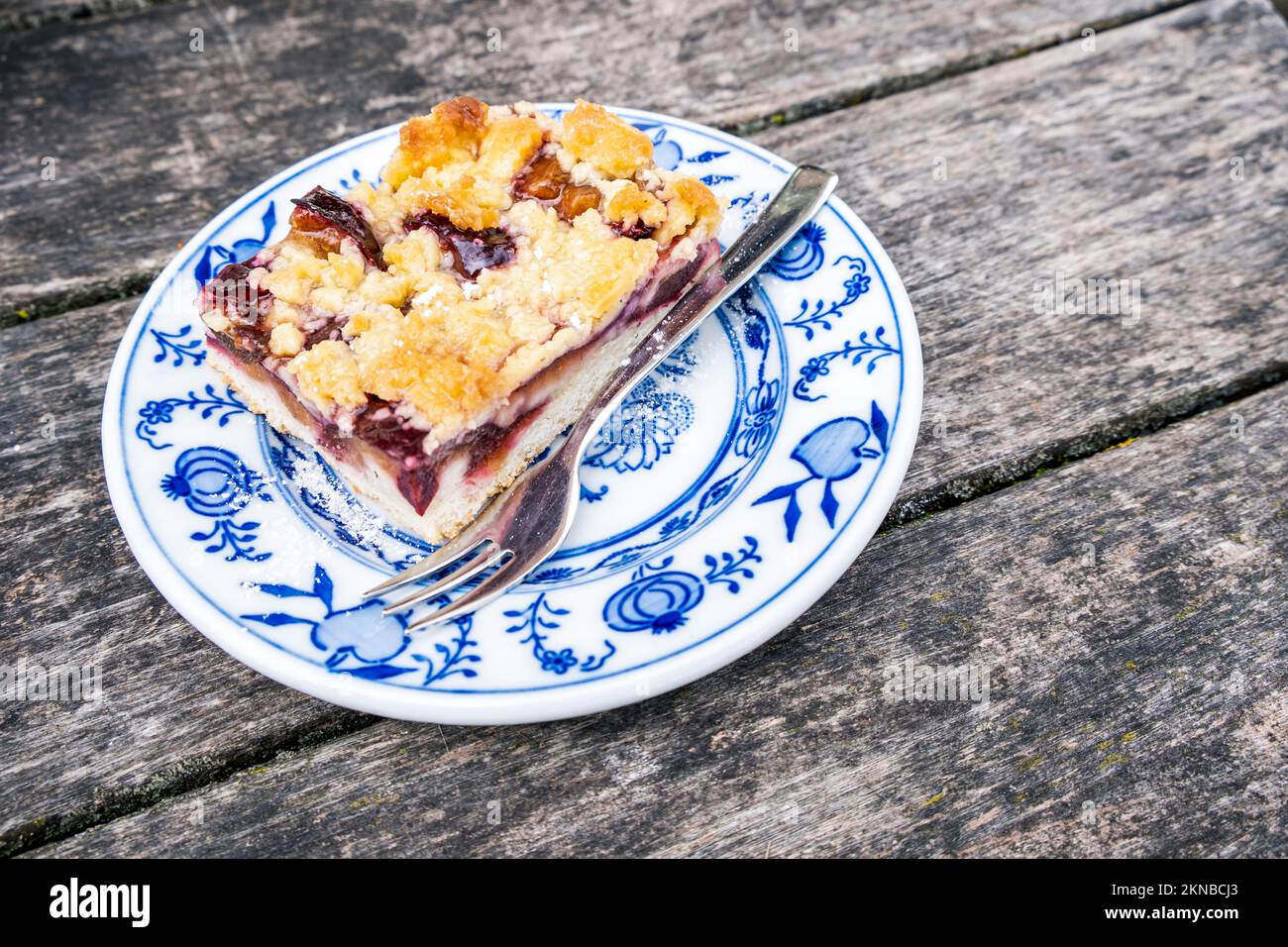 Overhead view of strudel cake on a wooden table outdoor. Bozen, Italy Stock Photo