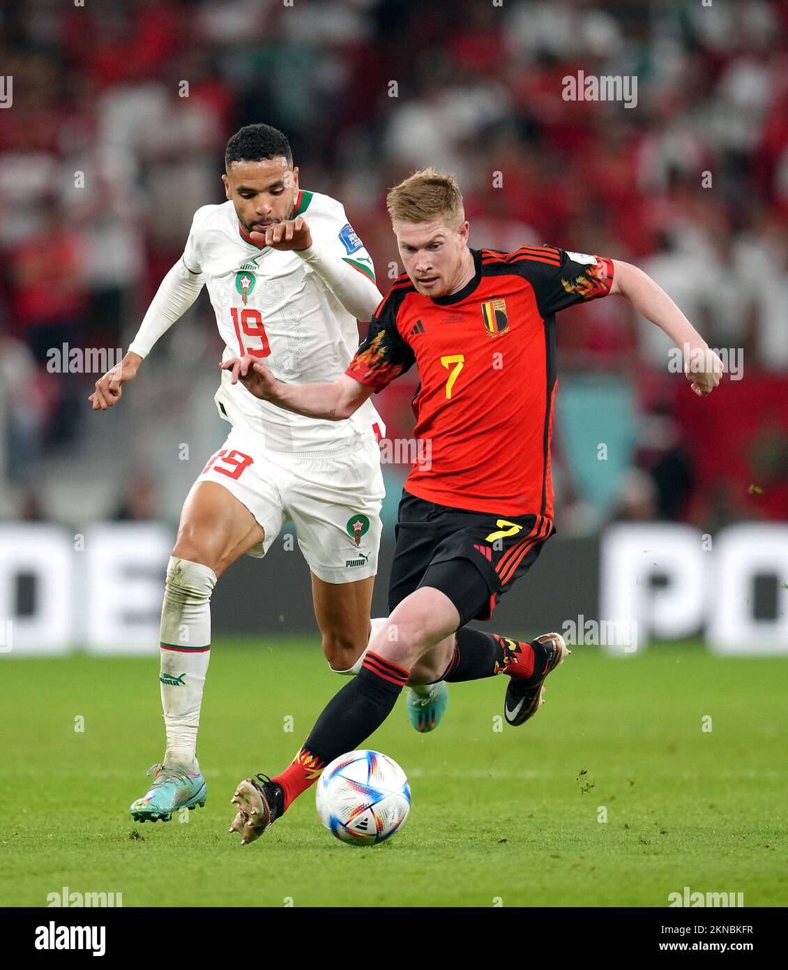Morocco’s Youssef En-Nesyri (left) and Belgium's Kevin De Bruyne battle for the ball during the FIFA World Cup Group F match at the Al Thumama Stadium, Doha, Qatar. Picture date: Sunday November 27, 2022. Stock Photo
