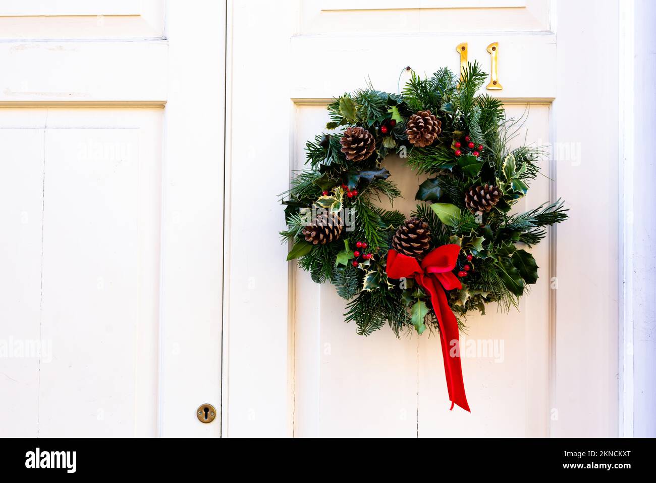 Wreath decoration at door for Christmas holiday Stock Photo