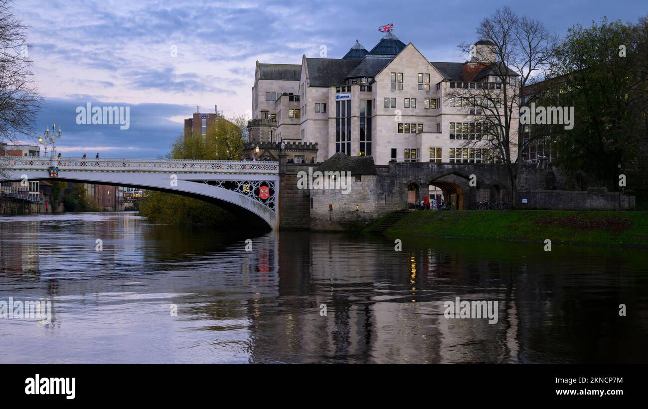 Lendal Bridge & waterfront buildings (Aviva office block) by River Ouse  (autumn evening) - picturesque York city centre, North Yorkshire, England UK. Stock Photo
