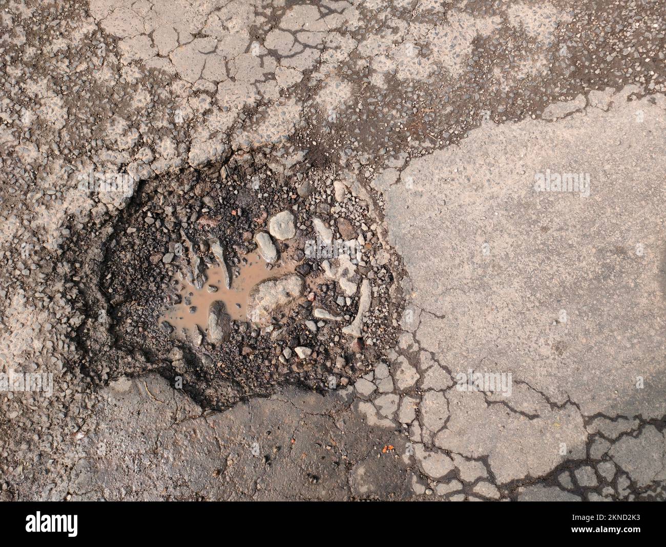 Flat lay or top view of holes or damaged in asphalt roads that can