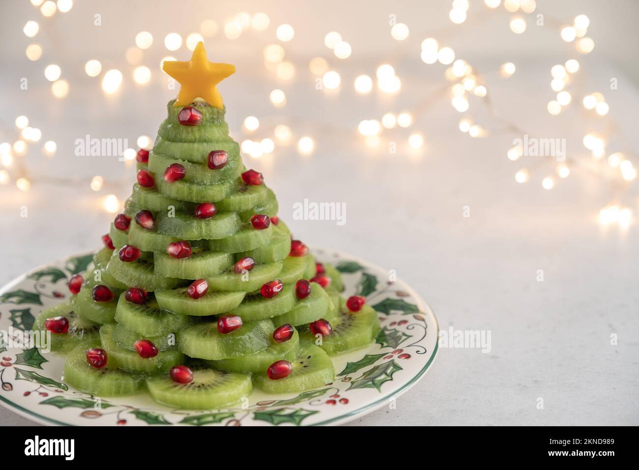 Christmas tree fruit salad with kiwi and pomegranate Stock Photo Alamy