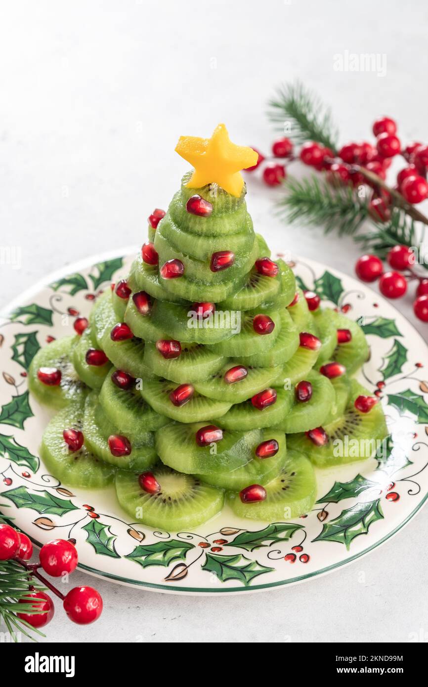 Christmas tree fruit salad with kiwi and pomegranate Stock Photo Alamy