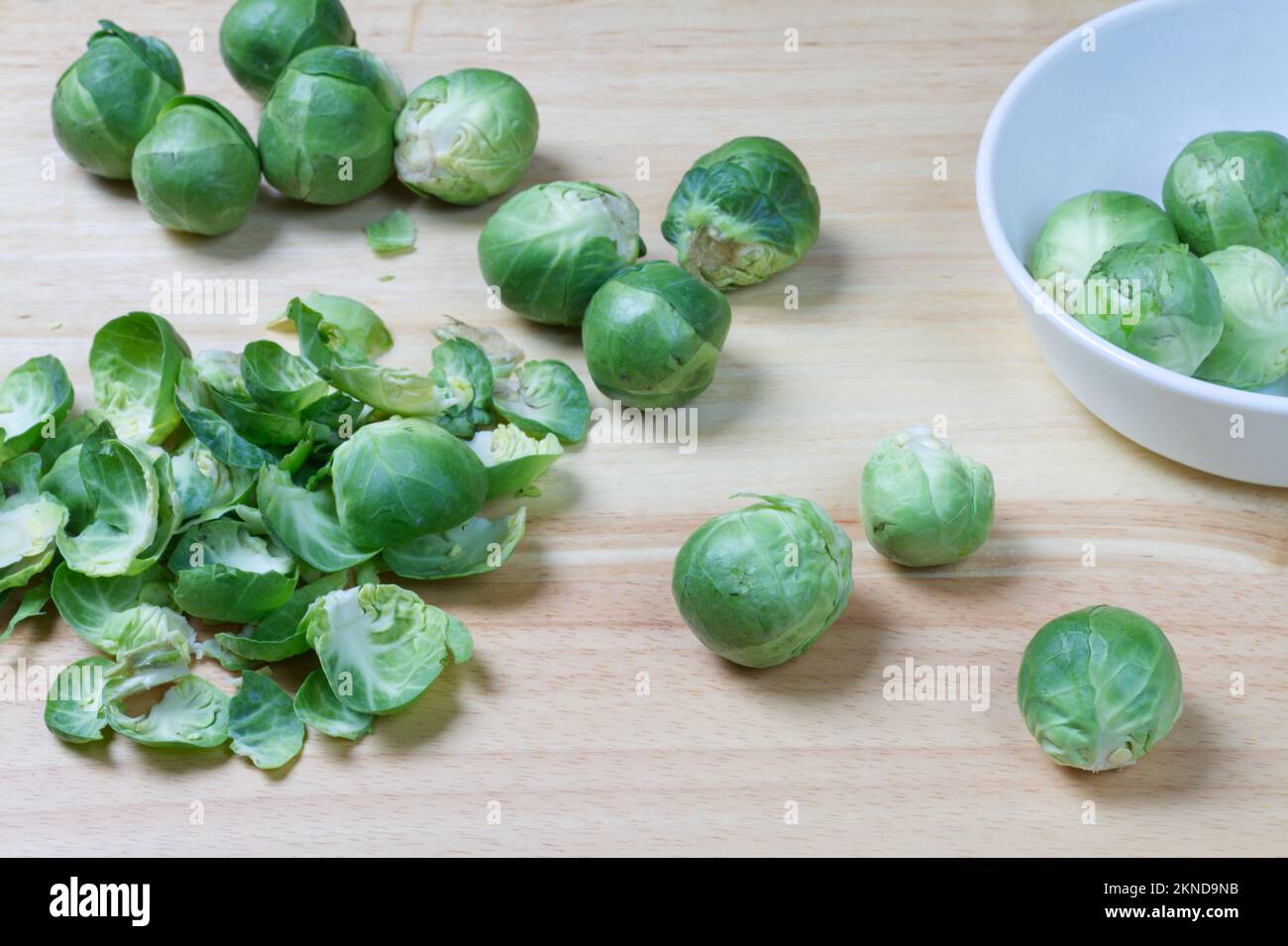 Sprouts, a winter vegetable, on a wood effect background. Stock Photo