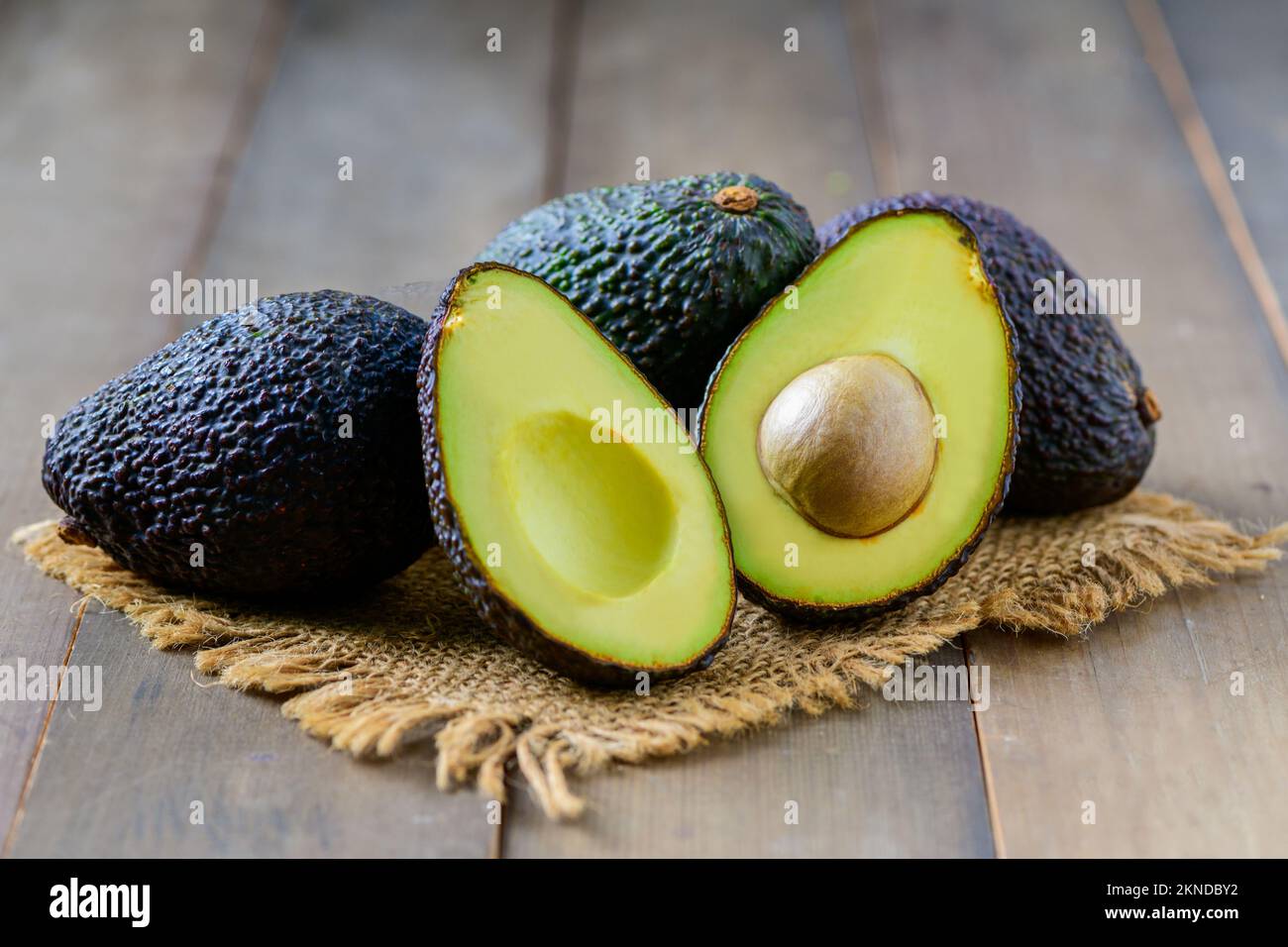 Fresh avocado on wood background, High in vitamins and minerals such as