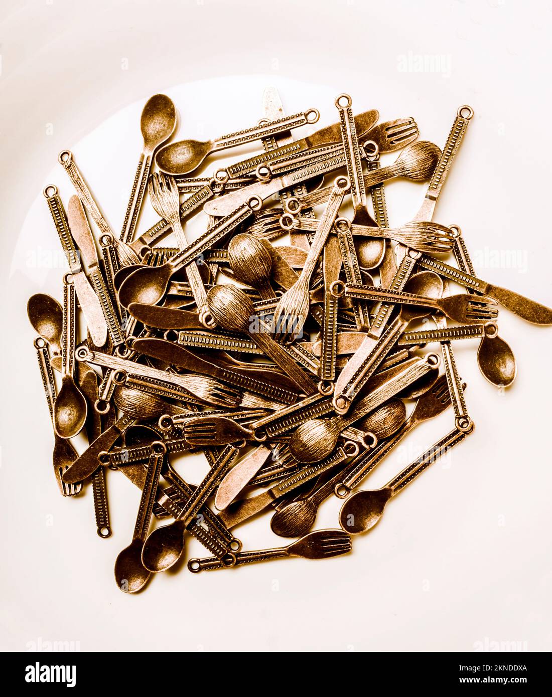 Still life stack of old kitchenware in an abstract placement on white background. Big banquet Stock Photo