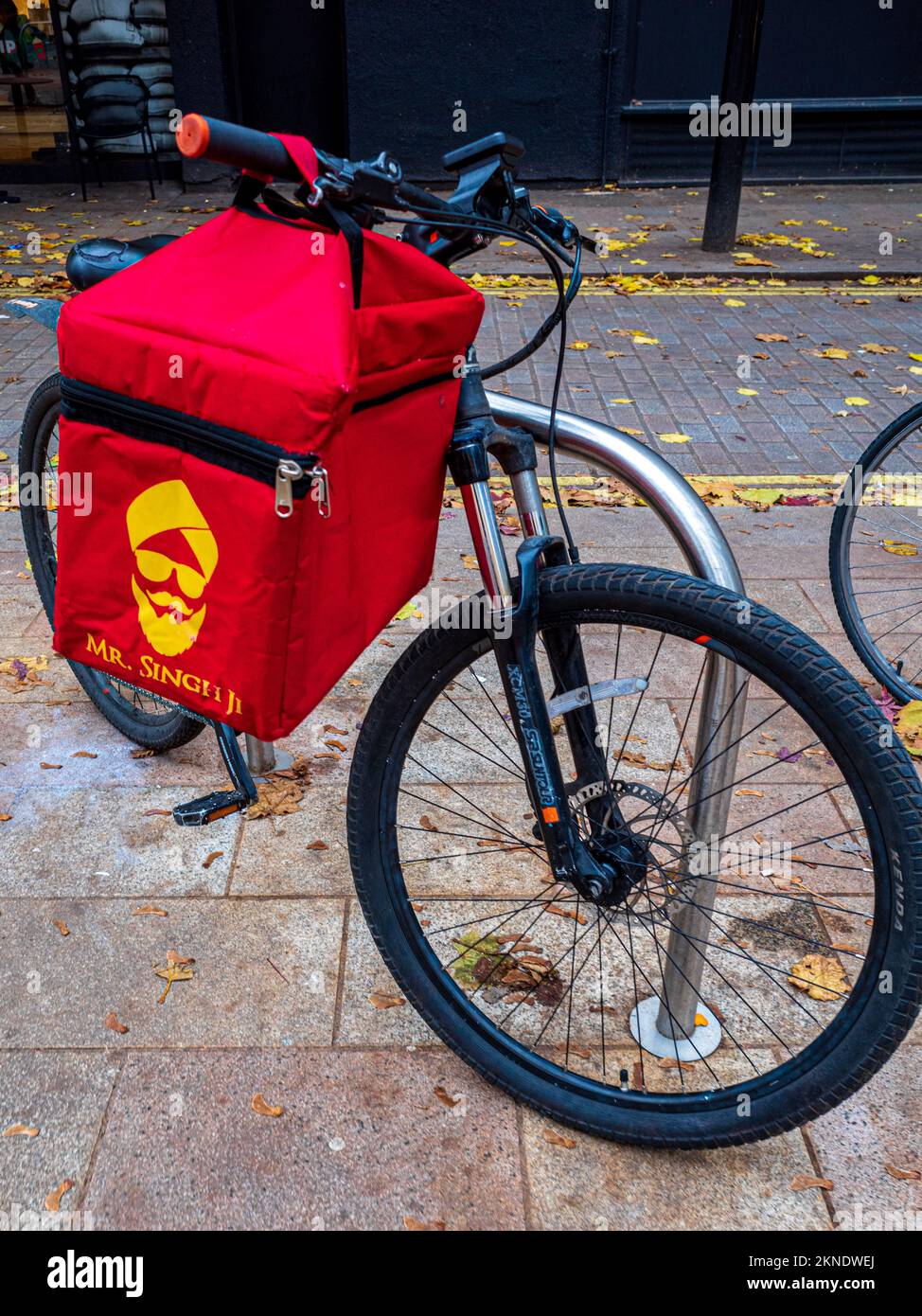 Mr. Singh Ji food delivery courier bag on a courier bike in London. Mr. Singh Ji is a specialised company making food delivery courier bags. Stock Photo