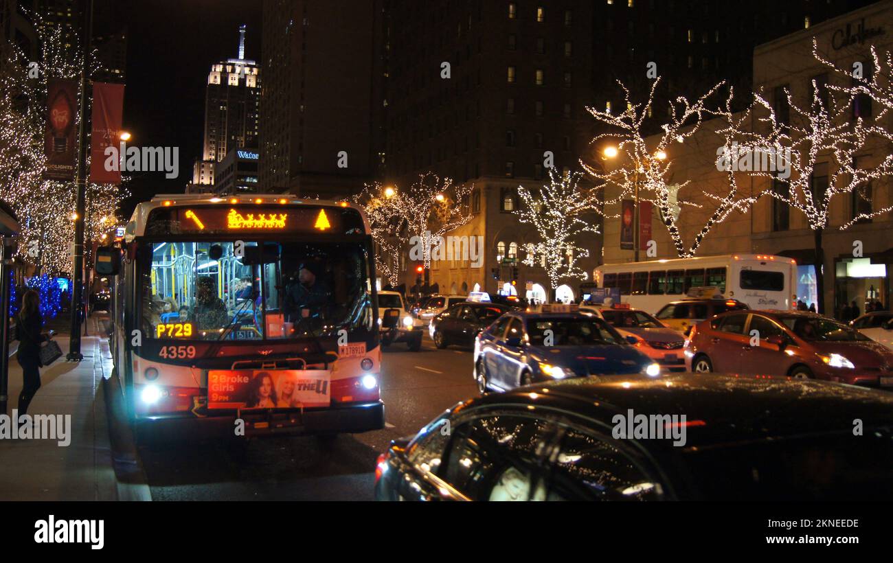 CHICAGO, ILLINOIS, UNITED STATES - DEC 12, 2015: Public bus during a winter night just before Christmas in downtown Stock Photo