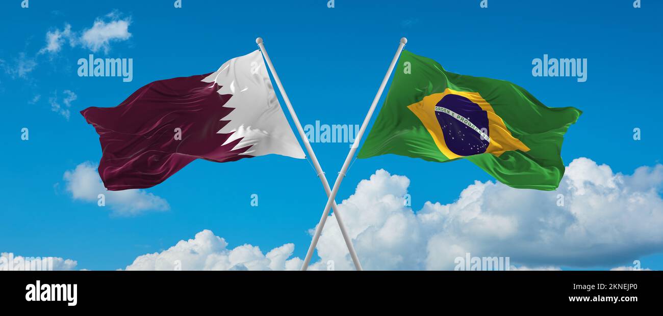 two crossed flags Brazil and Qatar waving in wind at cloudy sky ...