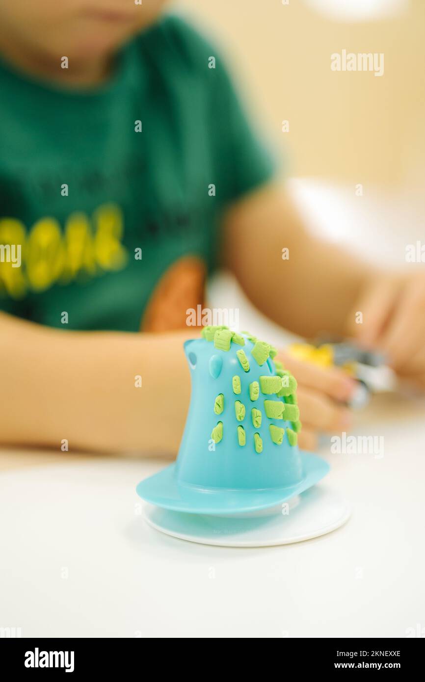 Children with kinetic sand. Hand of little kid Stock Photo