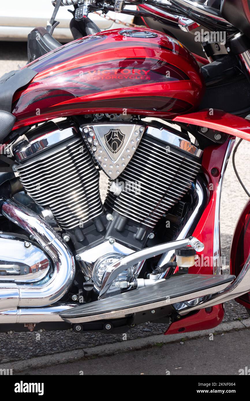 close up of red victory motorcycle custom tank and chrome engine cylinders Stock Photo