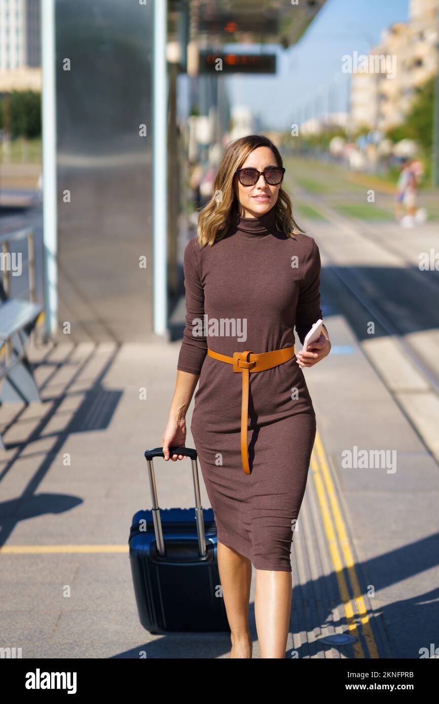 Female entrepreneur walking on railway station Stock Photo