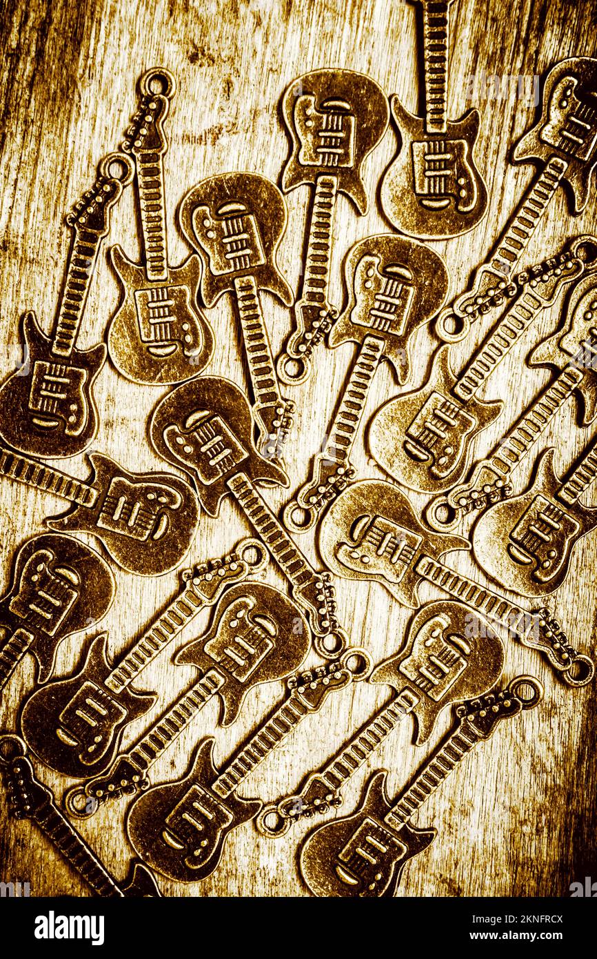 Abstract artwork on a mix of electric guitars on rustic wooden