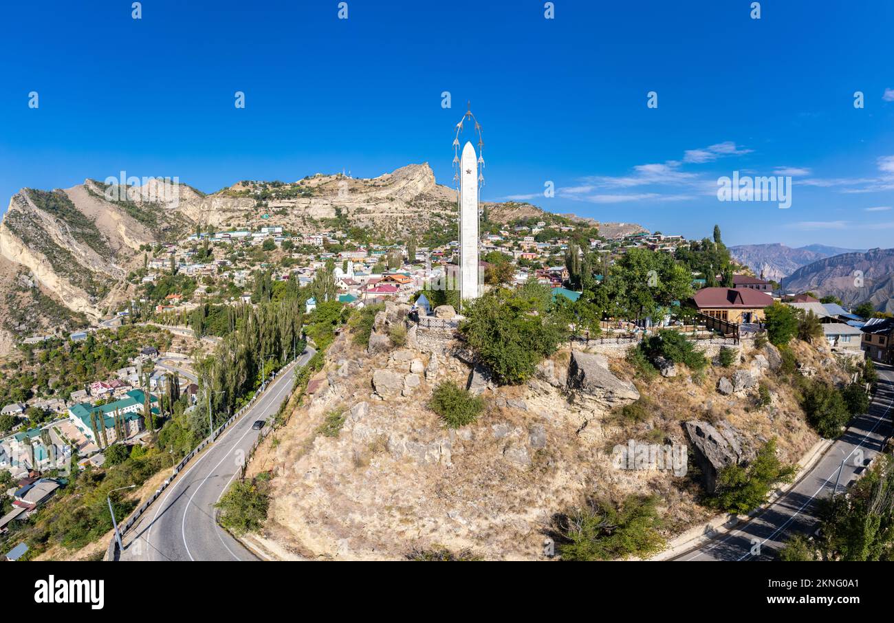 Aerial top view to village Gunib and famous attraction Memorial 'White cranes' in Victory Park. Famous village among the mountains and rocks. Summer s Stock Photo