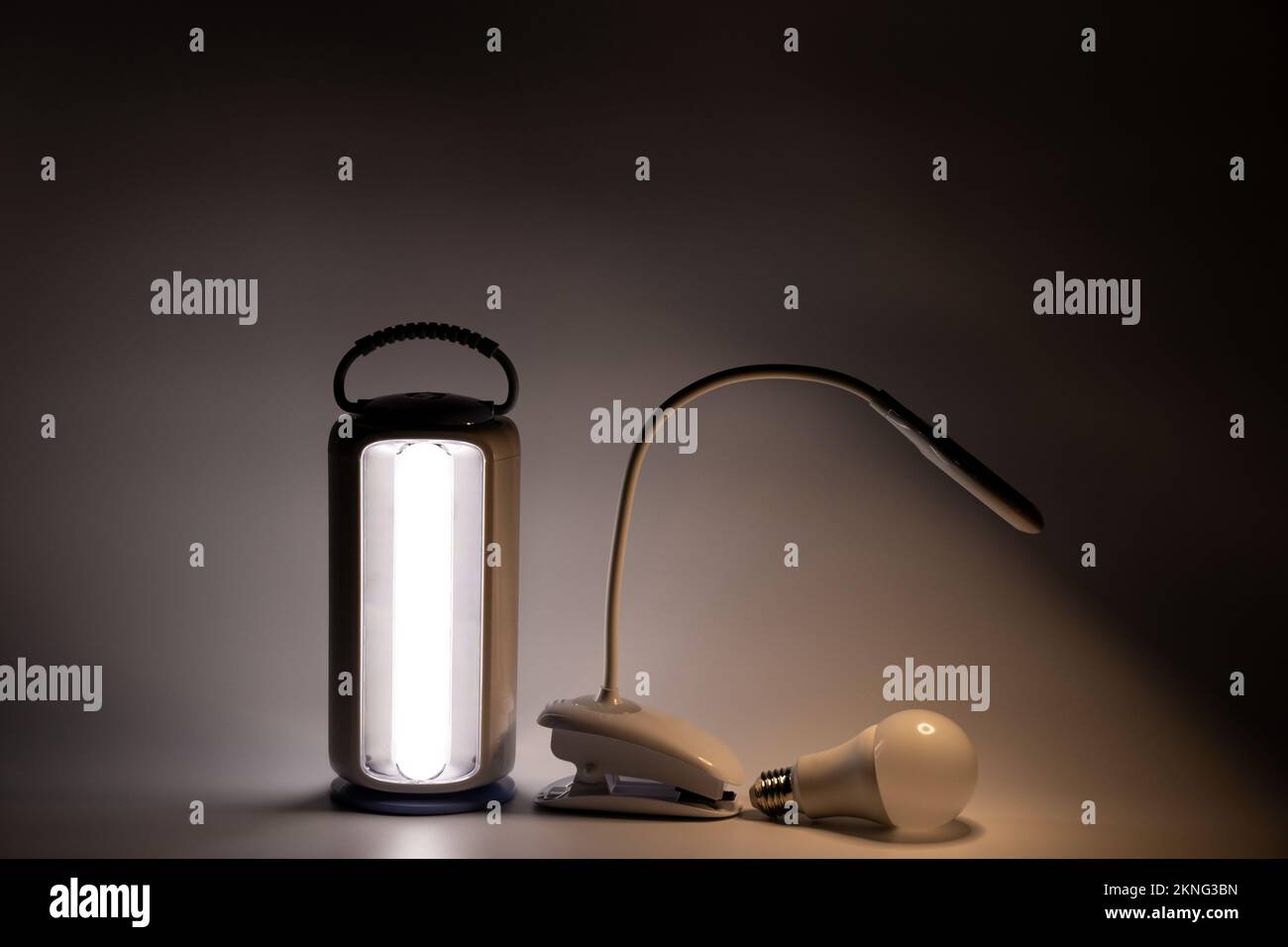 Portable and table led lamp and light bulb on white background glow in the dark without light, lamp Stock Photo