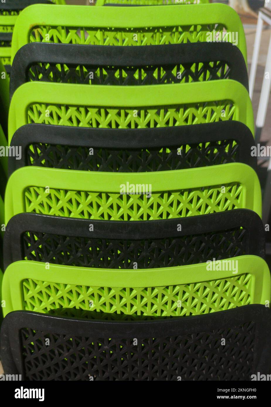 Pilled terrace plastic stools. Black and green color Stock Photo Alamy