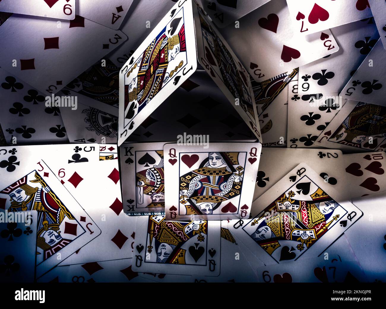 Still life photo on a stack of casino playing cards placed at a gamble of the house edge Stock Photo