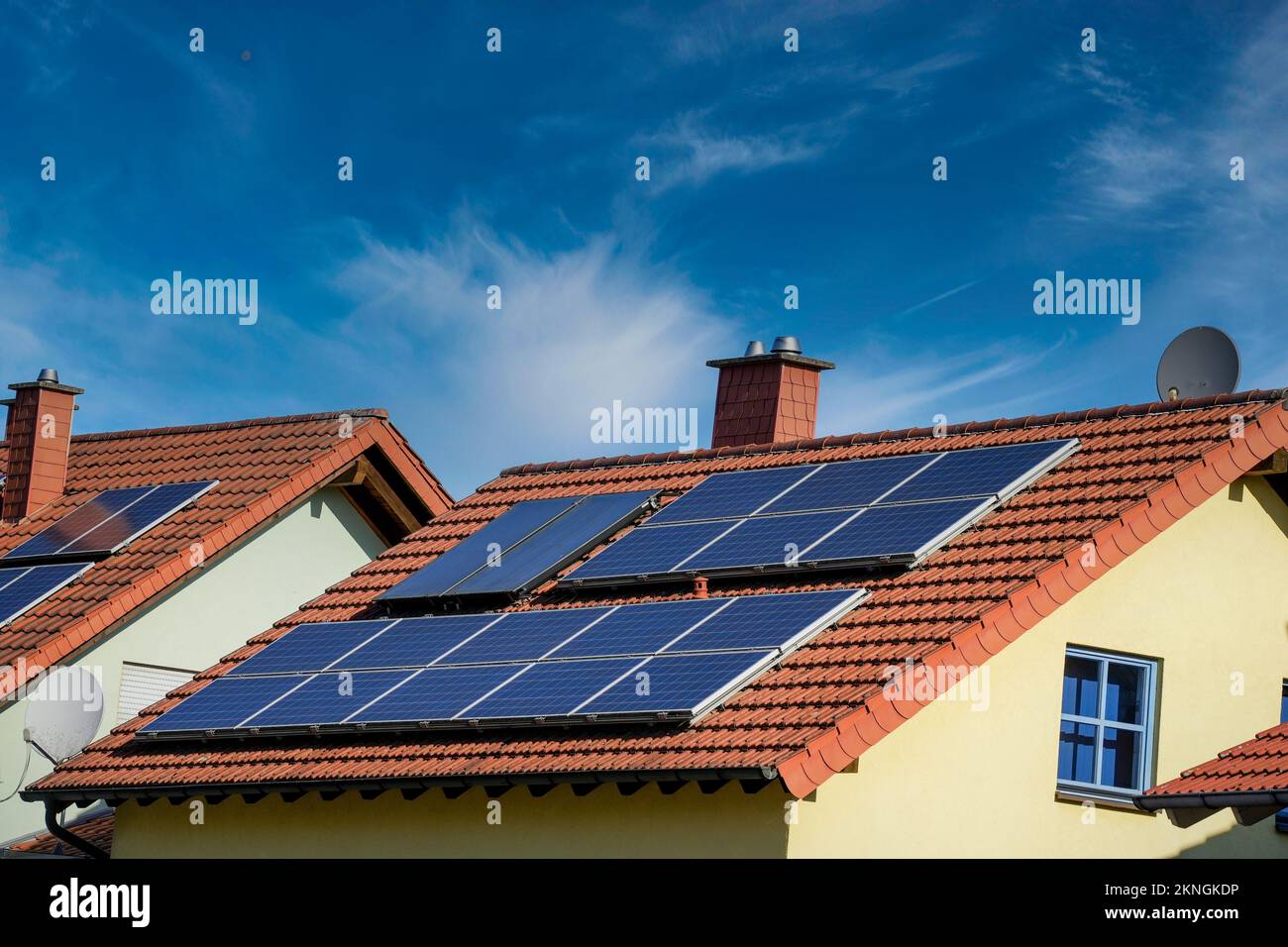 A handful of solar panels on roofs of a residential neighborhood