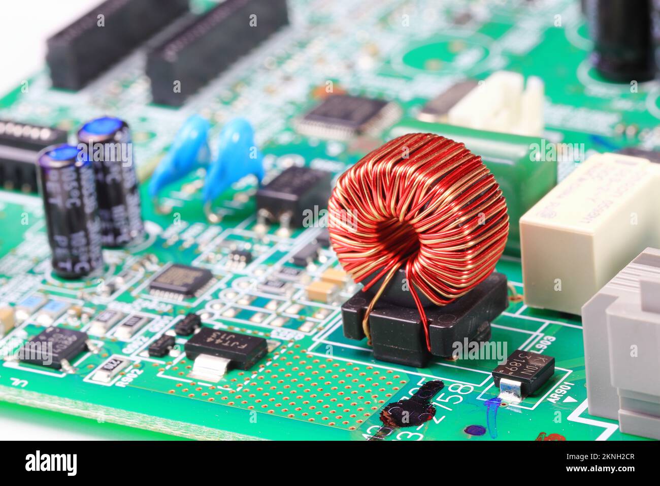 Copper coil or Inductance coil on circuit board, electronic components inside computer Stock