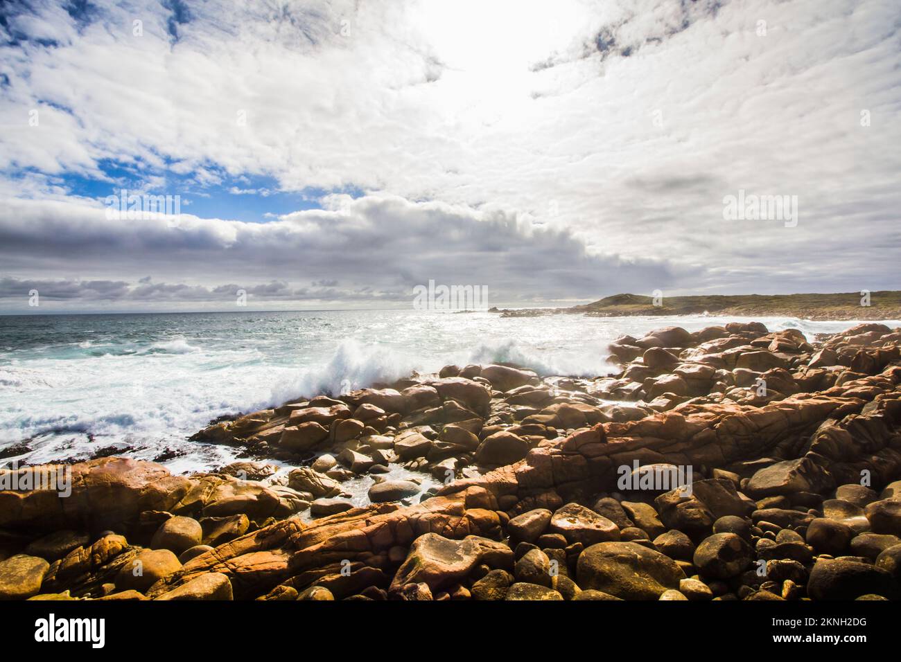 Beach sunrise with splashing waves at Granville Harbour, Tasmania