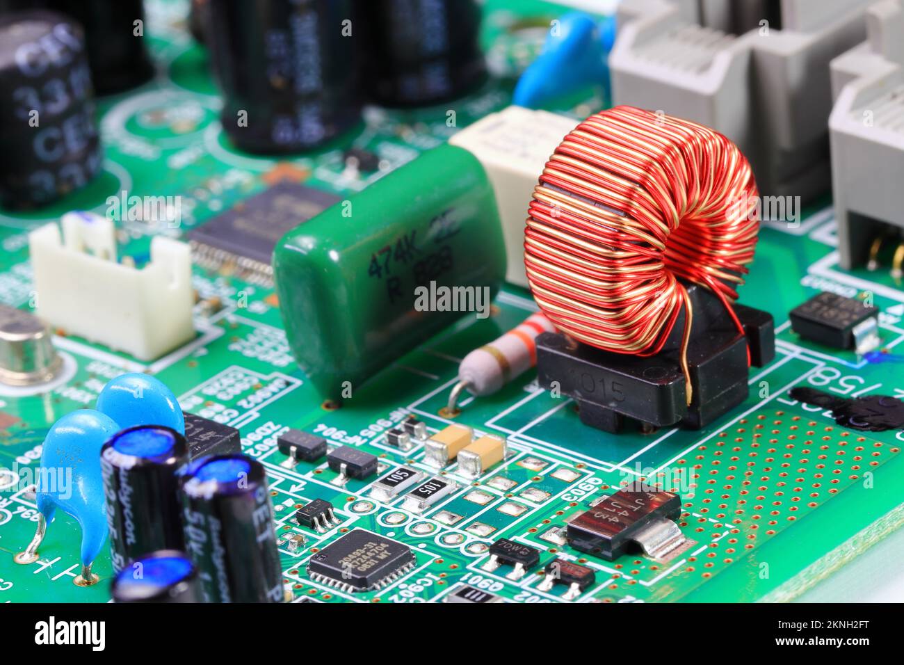 Copper coil or Inductance coil on circuit board, electronic components inside computer. Stock Photo