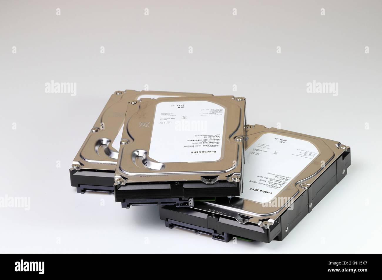 pile or stack of HDD, SSHD Hybrid hard disk drives 3.5' standard profile show on SATA interface, isolated on white background Stock Photo