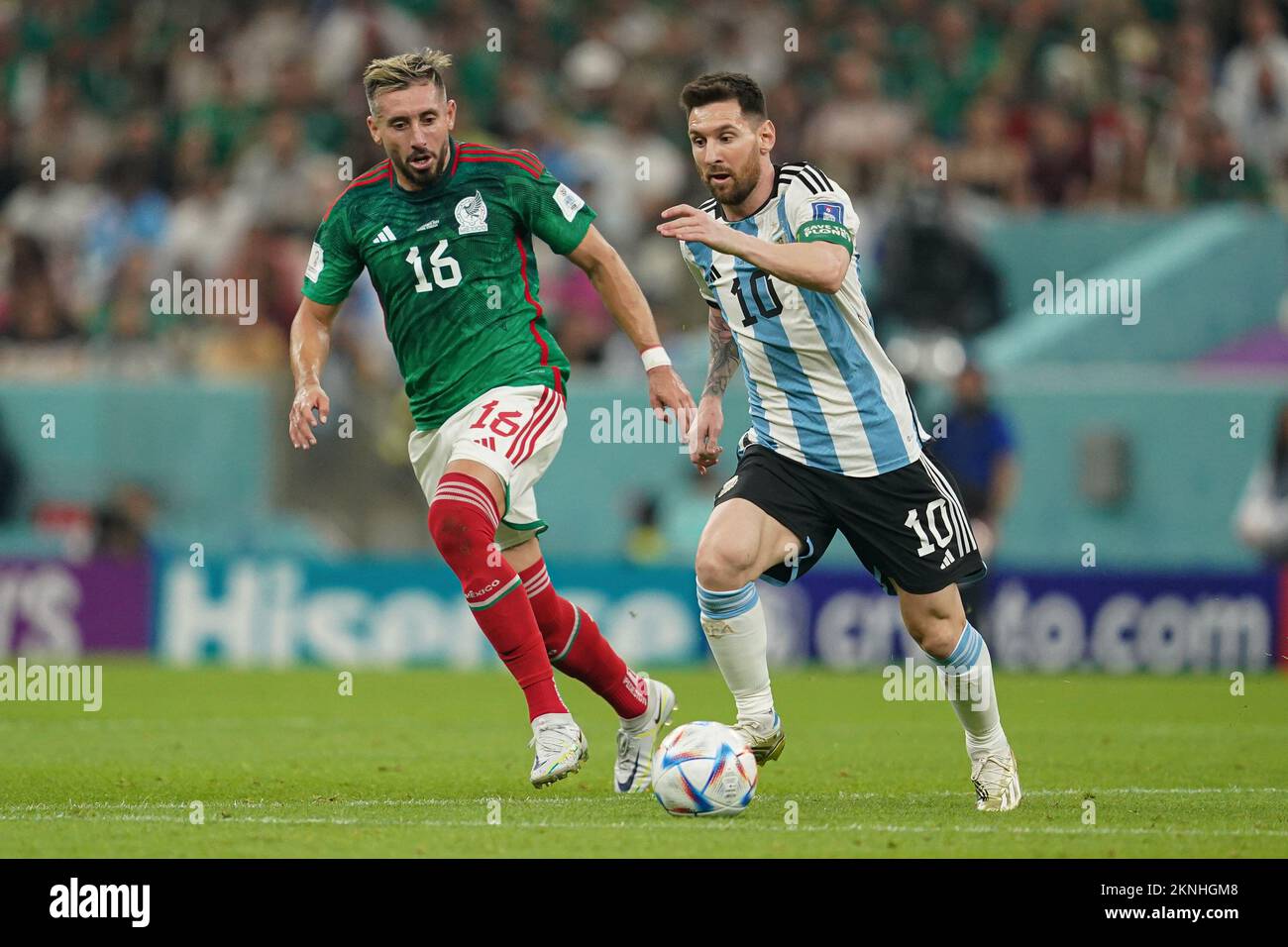 LUSAIL, QATAR - NOVEMBER 26: Player of Argentina Lionel Messi runs ahead of player of Mexico Héctor Herrera during the FIFA World Cup Qatar 2022 group C match between Argentina and Mexico at Lusail Stadium on November 26, 2022 in Lusail, Qatar. (Photo by Florencia Tan Jun/PxImages) Stock Photo