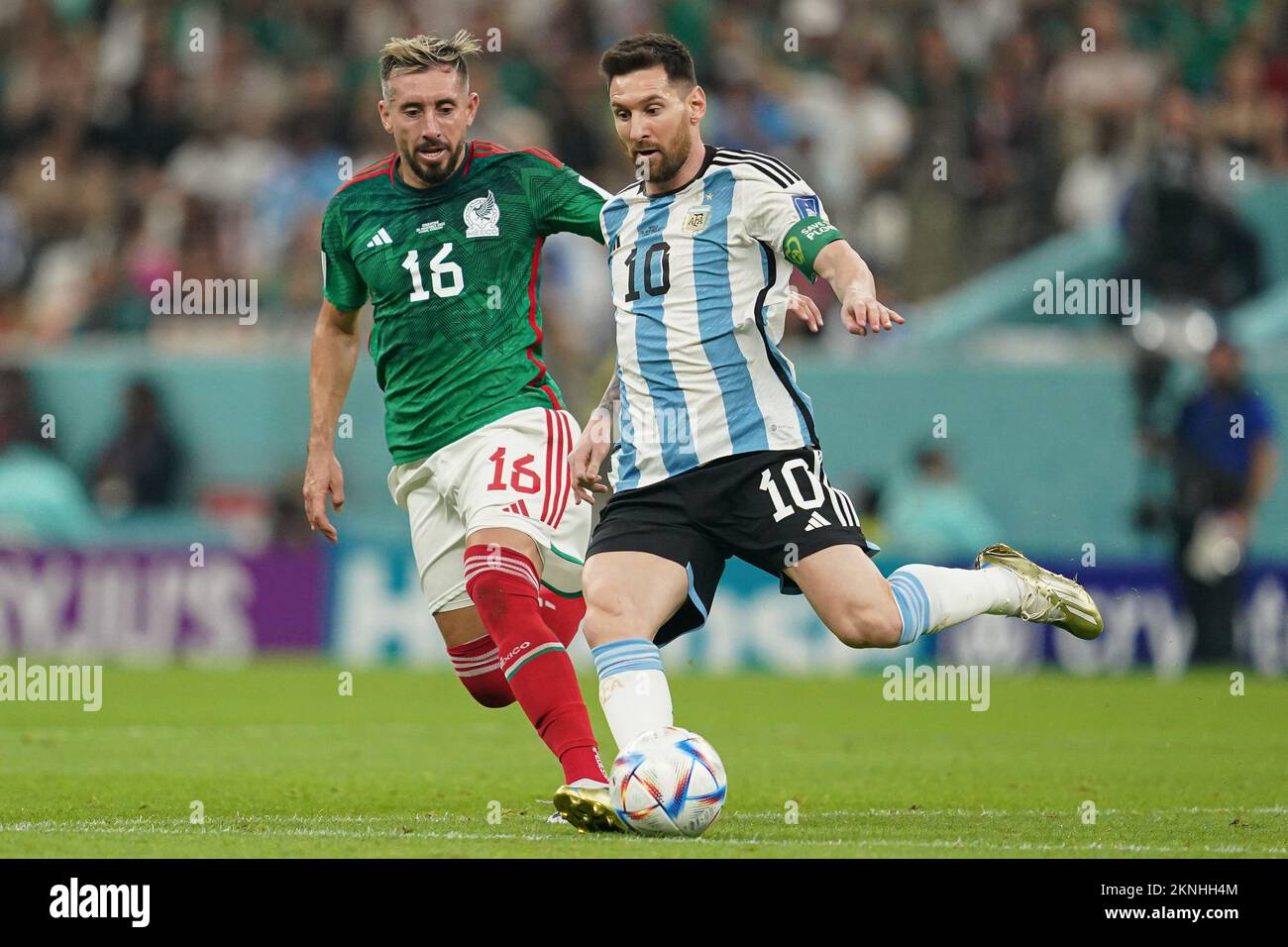 LUSAIL, QATAR - NOVEMBER 26: Player of Argentina Lionel Messi runs ahead of player of Mexico Héctor Herrera during the FIFA World Cup Qatar 2022 group C match between Argentina and Mexico at Lusail Stadium on November 26, 2022 in Lusail, Qatar. (Photo by Florencia Tan Jun/PxImages) Stock Photo