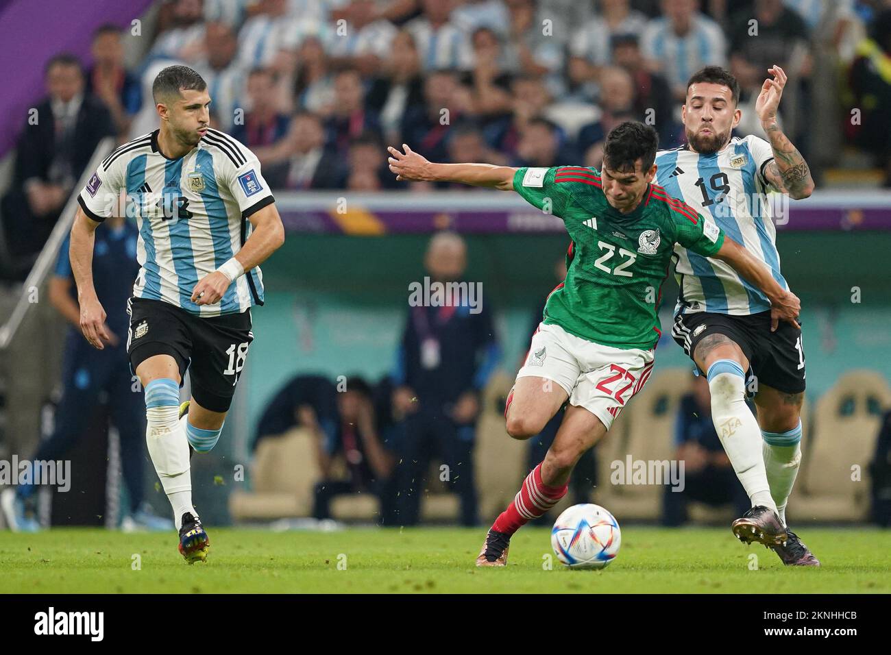 LUSAIL, QATAR - NOVEMBER 26: Player of Argentina Nicolás Otamendi and Thiago Almada fights for the ball with player of Mexico Hirving Lozano during the FIFA World Cup Qatar 2022 group C match between Argentina and Mexico at Lusail Stadium on November 26, 2022 in Lusail, Qatar. (Photo by Florencia Tan Jun/PxImages) Stock Photo