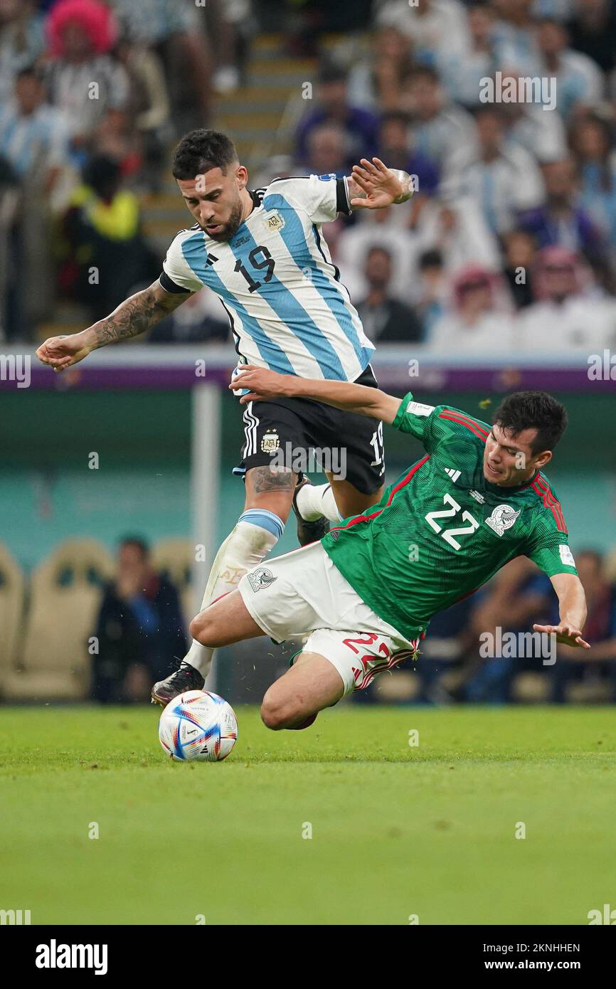 LUSAIL, QATAR - NOVEMBER 26: Player of Argentina Nicolás Otamendi fights for the ball with player of Mexico Hirving Lozano during the FIFA World Cup Qatar 2022 group C match between Argentina and Mexico at Lusail Stadium on November 26, 2022 in Lusail, Qatar. (Photo by Florencia Tan Jun/PxImages) Stock Photo