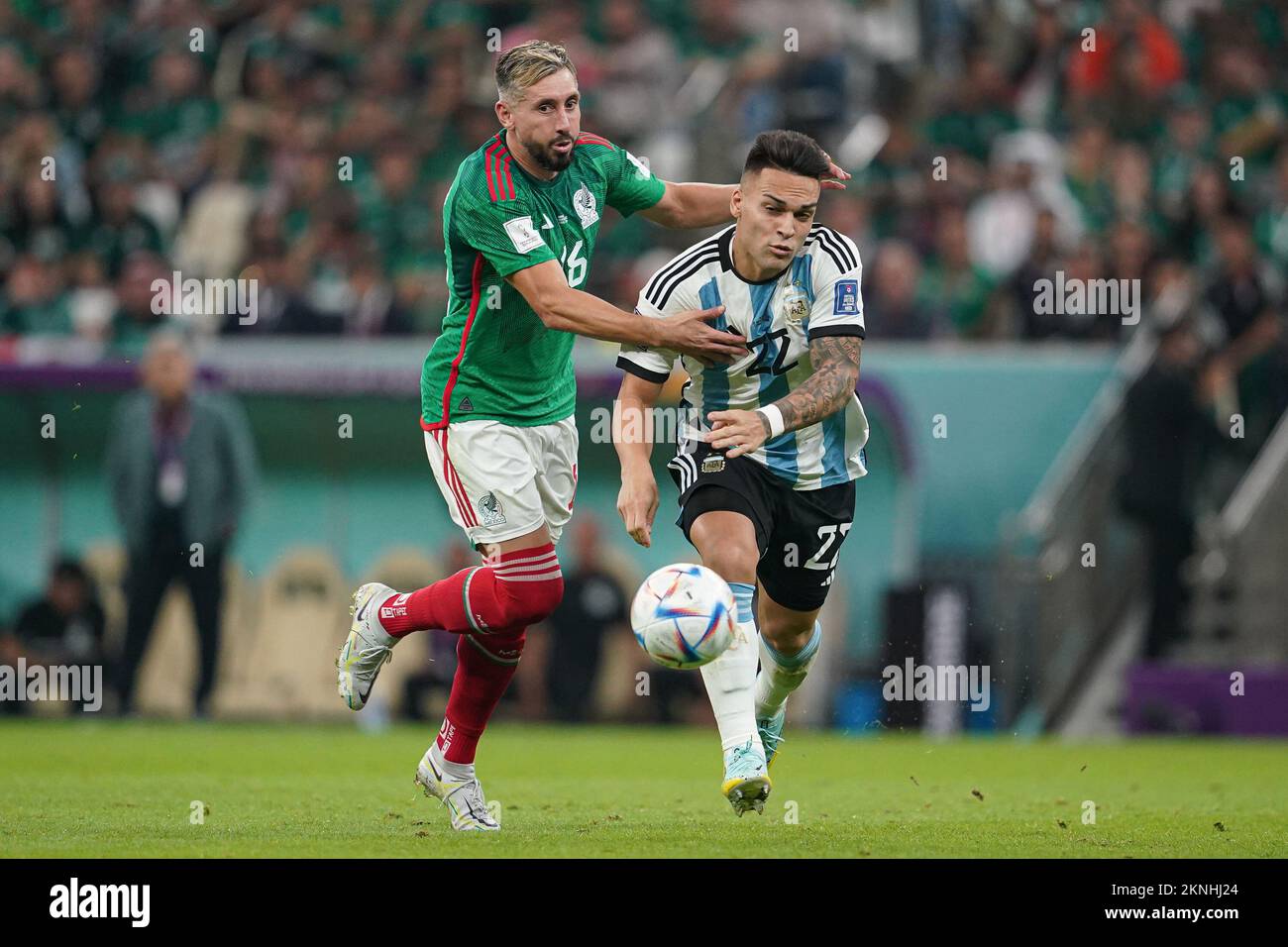 LUSAIL, QATAR - NOVEMBER 26: Player of Argentina Lautaro Martínez fights for the ball with player of Mexico Héctor Herrera during the FIFA World Cup Qatar 2022 group C match between Argentina and Mexico at Lusail Stadium on November 26, 2022 in Lusail, Qatar. (Photo by Florencia Tan Jun/PxImages) Stock Photo